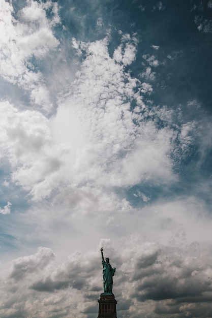 Statue of liberty against cloudy sky