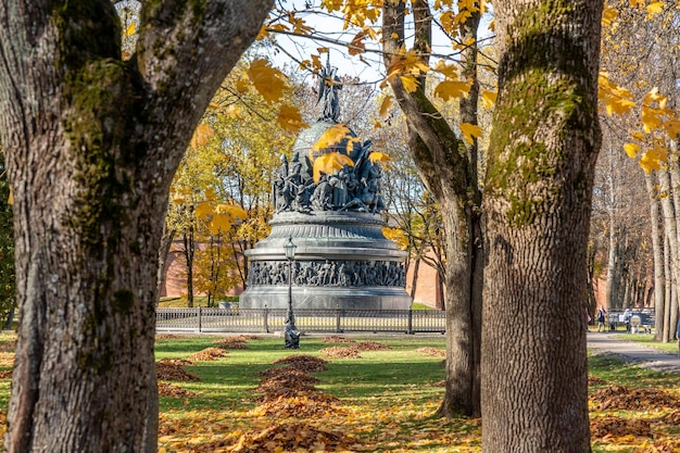 A statue of liberty stands in the park in autumn