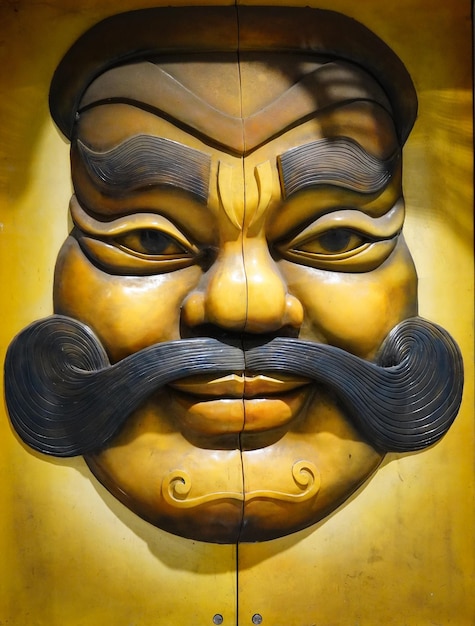 A statue of a man having big mustache indian