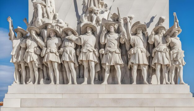 Photo a statue of a man holding a stick and a hat