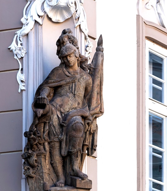 A statue of a man with a flag on his arm