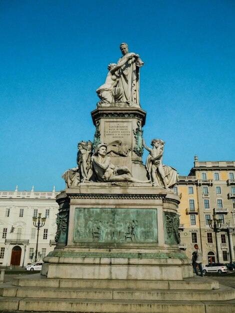 A statue of a man with a sword on it