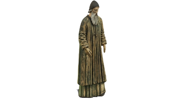 A statue of a monk with a hat and a hat