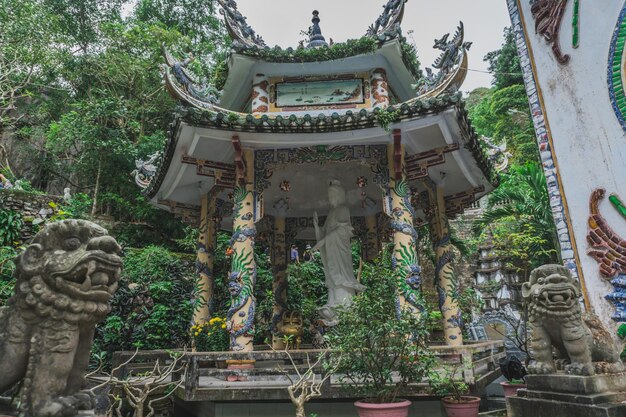 Statue of temple against building