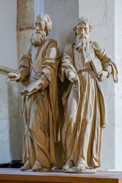 Statue of two men in the Church on the Hill in Sighisoara Transylvania Romania