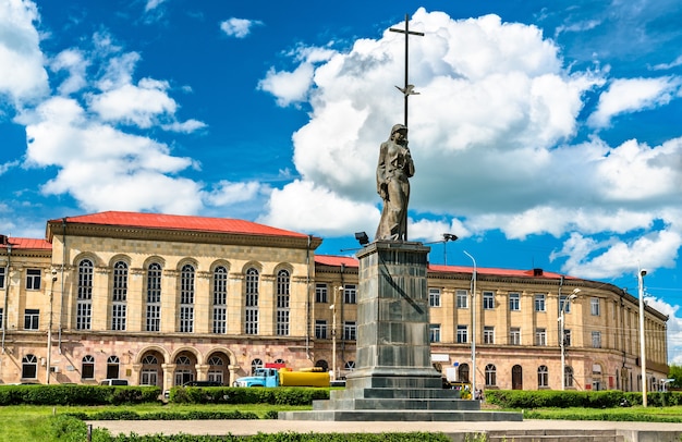 A statue and the University at Independence Square in Gyumri, Armenia