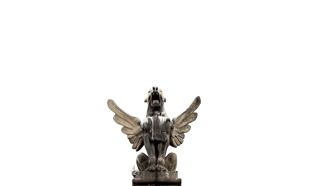 A statue of a winged creature with wings and a white background