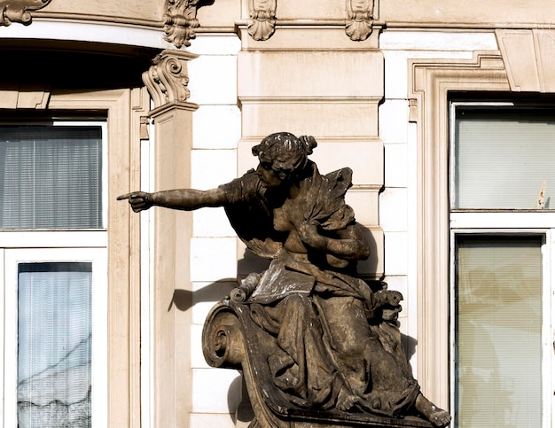 A statue of a woman pointing at something.