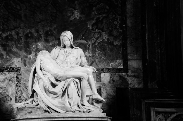 Statue of woman sitting in temple