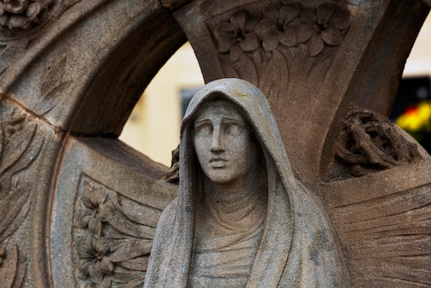 A statue of a woman with a hood on