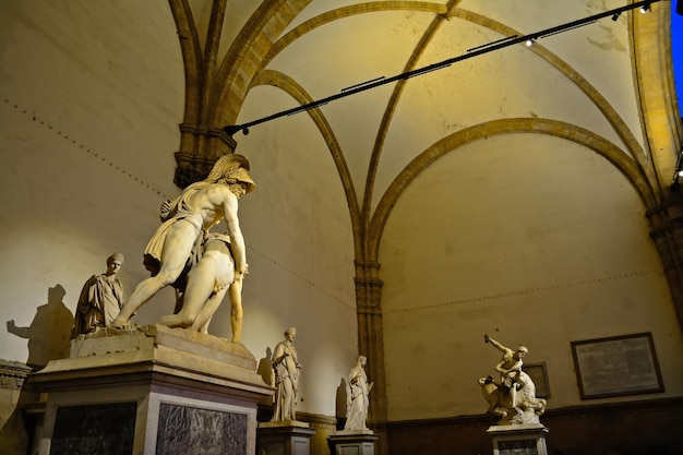 Statues in Loggia de Lanzi by night Florence