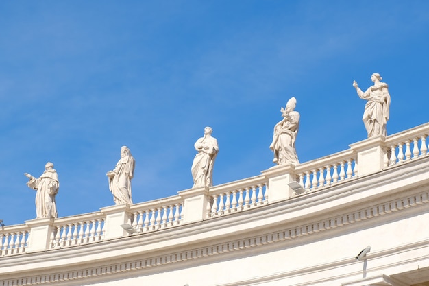 Statues at Saint Peterâs Basilica with blue sky famous land mark at Rome Italy.