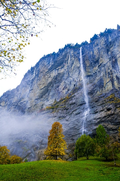 Staubbach Falls with the mist in autumn morning.