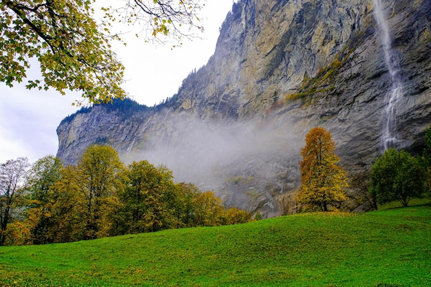 Staubbach Falls with the mist in autumn morning.