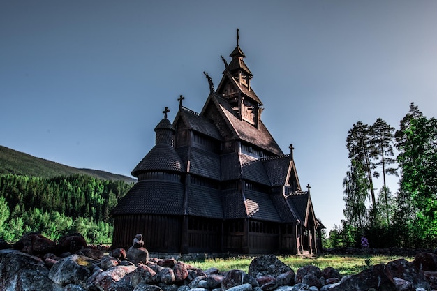 Photo stavkirke church at the cemetery park in norway in summer