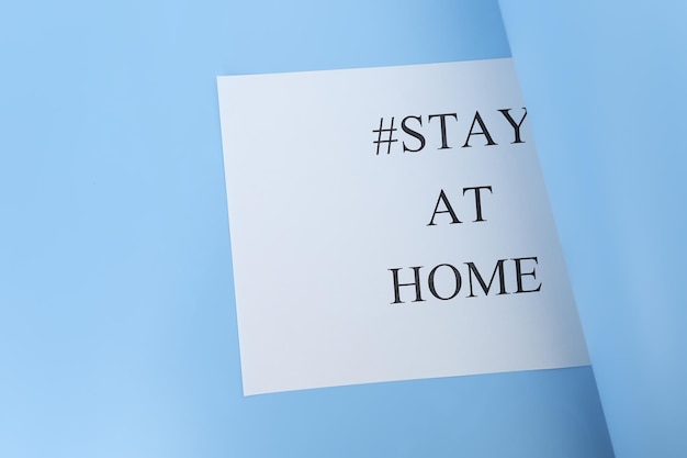 Photo stay at home concept paper with words stay at home isolated on white background coronavirus covid19 selfquarantine isolation