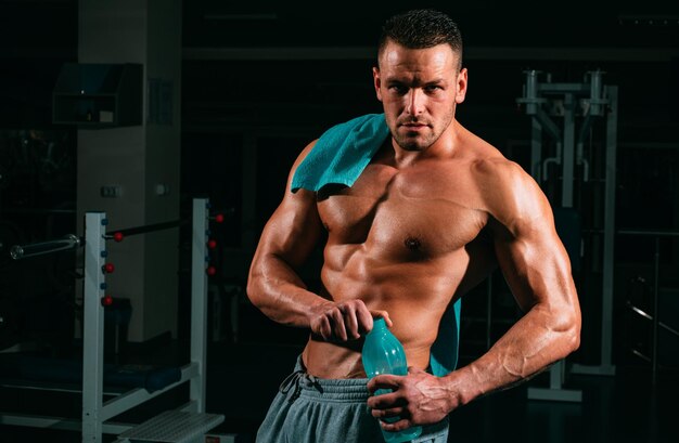 stay hydrated concept weightlifter gym man preparing for training muscular athletic body sport