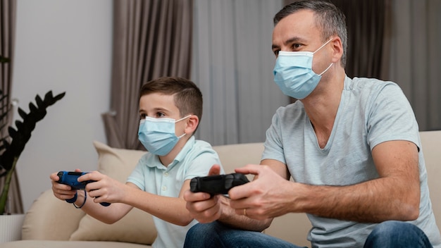 Stay indoors man and kid playing video games