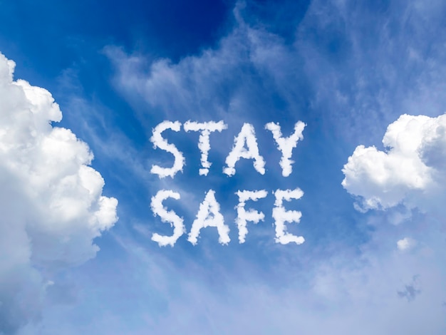 Stay safe concept. blue sky background with white fluffy cloud\
message \