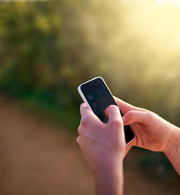 Staying connected on the move Shot of an unidentifiable woman sending a text message while in a park