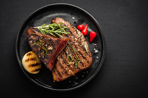 steak beef. beef steak medium with red pepper, aromatic herbs and fried onion