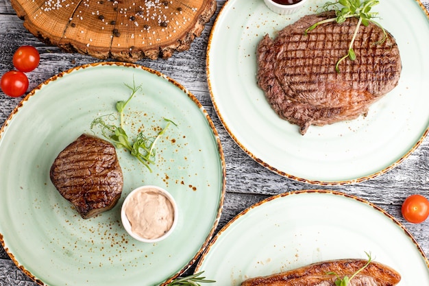 Steak beef steak grilled beef on a wooden white background