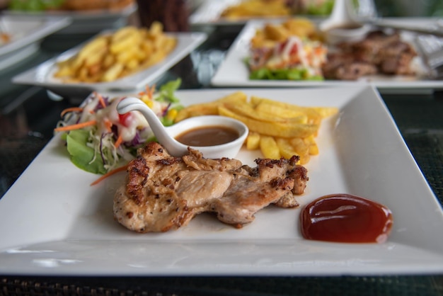 Steak chicken and salad vegetable in dish on table