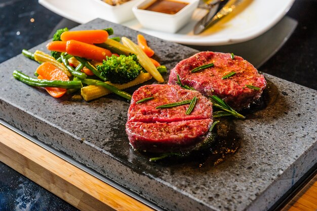 Steak cooked on lava-stone.