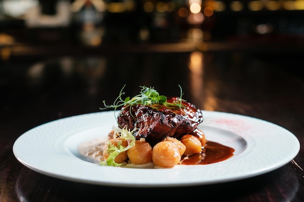 Steak grilled with potatoes and sauce