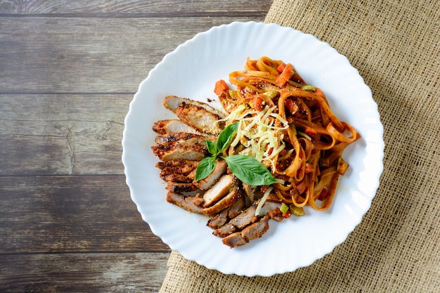 Steak meat with spaghetti and cheese on wood ,