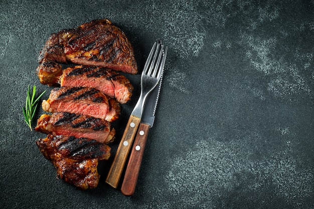 Steak ribeye, grilled with pepper and garlic.