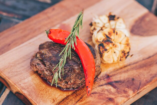 A steak with a red pepper on it