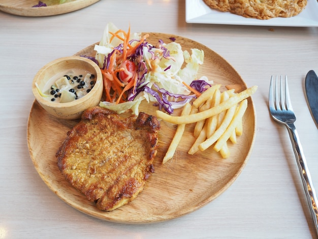 steak on wooden plate