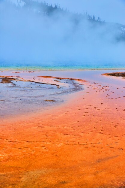 Steam covers iconic grand prismatic spring in yellowstone winter