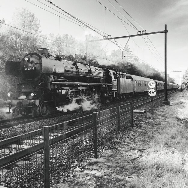 Steam train against sky