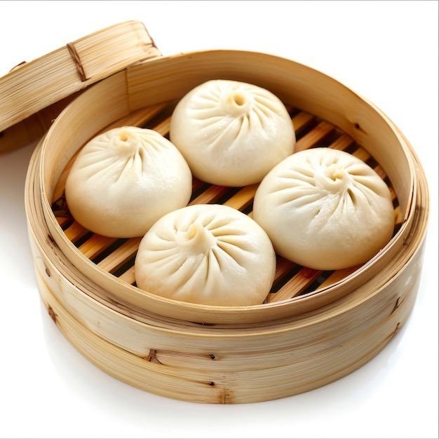 Steamed buns in a bamboo steamer on a white background Asian cuisine and cooking concept