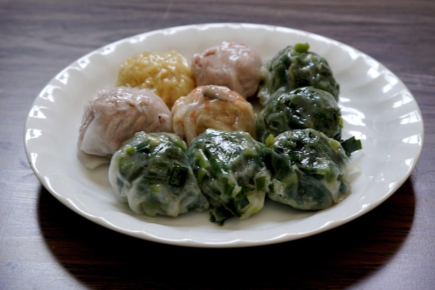Steamed chives dumplings on the wooden table