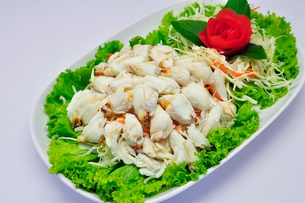 Steamed crab meat on white plate and white background