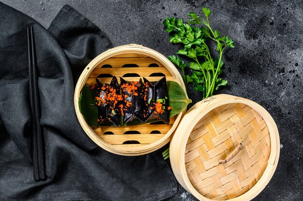 Steamed dumplings Dim Sum in bamboo steamer.