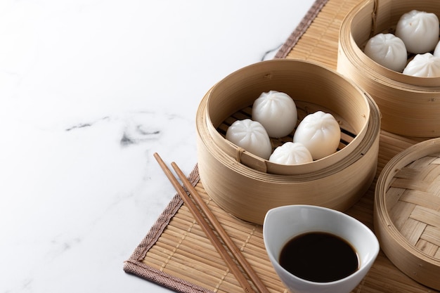 Steamed dumplings on marble background