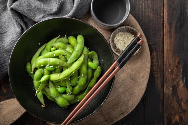 Steamed edamame soybeans on a wooden background view from above