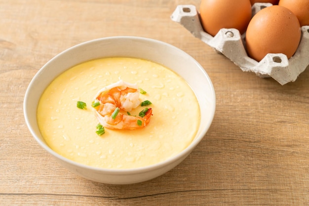 Steamed egg with shrimp and spring onions on top