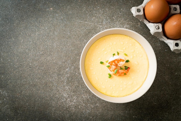 Steamed egg with shrimp and spring onions on top