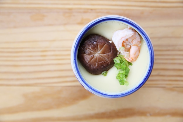 Steamed eggs on wood background