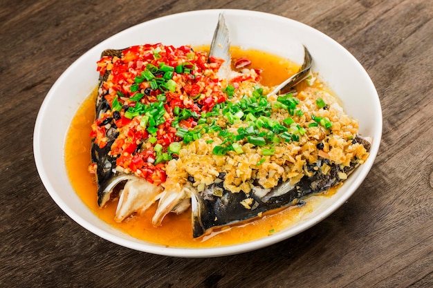 Photo steamed fish head with diced hot red peppers