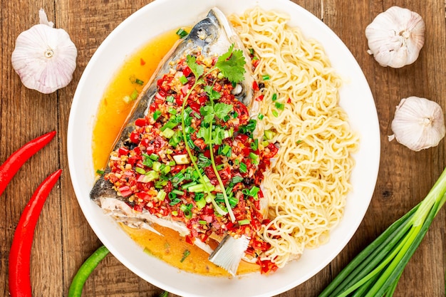 Steamed fish head with diced hot red peppers