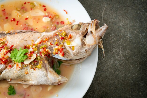 Photo steamed grouper fish with lime and chillies