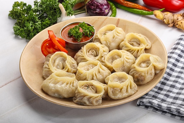 Steamed Nepali dumpling Momo with sauce stuffed chicken meat seafood or vegetables