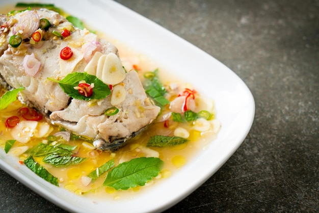 Steamed sea bass fish with herbs