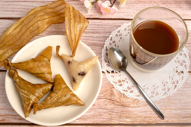 Steamed sweet sticky rice in triangle shaped traditional Southern Thai desserts